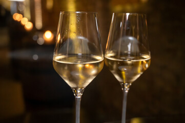 Visit of wine cellar, tasting of brut champagne sparkling wine produced by traditional method in underground caves close up
