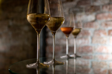 Visit of wine cellar, tasting of brut champagne sparkling wine produced by traditional method in underground caves close up