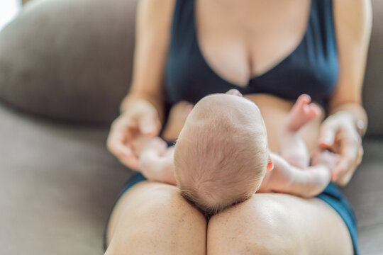 A newborn baby rests peacefully on the mother lap, feeling warmth, security, and love. A tender moment of bonding, trust, and comfort, symbolizing early childhood and the deep connection between