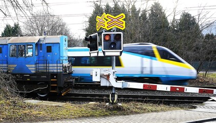 A modern high-speed train passes by an old steam locomotive, symbolizing the contrast between past and present in railway technology. A powerful visual of progress, history, and movement.


