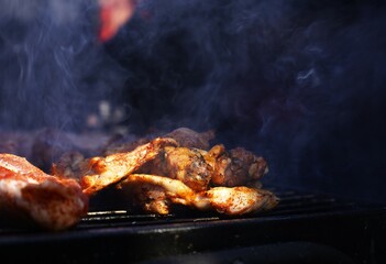 Juicy steaks sizzling on an outdoor grill. Smoky flavor, open fire, and perfect sear—authentic barbecue in nature. Great for food, camping, and outdoor cooking themes.