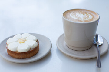 A perfect coffee paired with a delicious dessert.