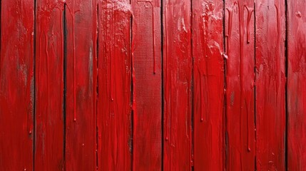 Red oil paint texture on a vertical wooden wall, featuring a vibrant red surface with dripping paint for an artistic and bold backdrop.