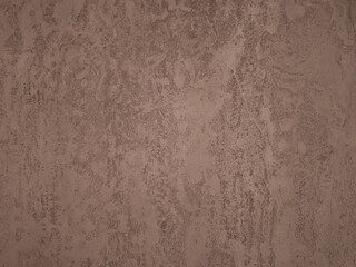 Brown textured concrete wall background creating modern ambiance