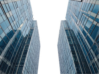 Modern skyscrapers with reflective glass facades reaching towards a cloudy sky.