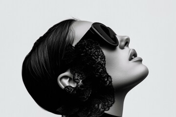 Elegant woman in profile with black lace and oversized sunglasses in retro style  .