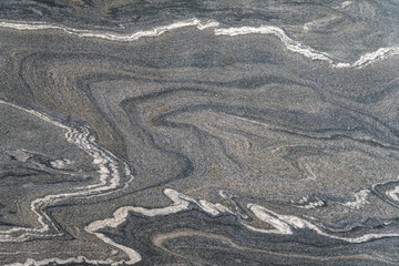 Texture of Asian granite with silver base and white veins