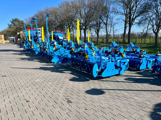 Transportation of agricultural machinery in a truck — seeder and cultivator loaded on a trailer