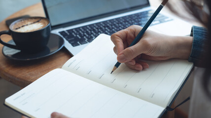 Business woman planning daily appointment and writing on business calendar planner notebook at office. event planning, Planner plan schedule calendar and reminder agenda