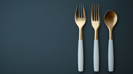Minimal golden cutlery set on dark surface. Copy space