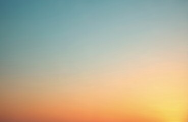 Obraz premium Sunset sky with orange, yellow, red, blue gradient colors. Clear sky without clouds. Natural light, vibrant colours for background, wallpaper. Beautiful empty space for text, design. Calm, relaxing