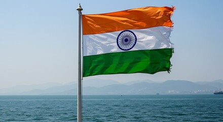 The vibrant Indian flag waving proudly against a backdrop of tranquil seascape
