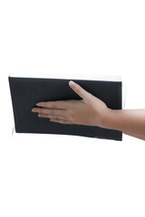 Naklejka premium Close up of a hand holding a sleek black rectangular electronic device likely a mobile phone or tablet in a minimalist modern setting