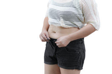 Stylish and confident young woman wearing a sleek casual outfit with a white crop top and black shorts posing in a minimalist studio setting