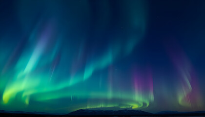 aurora bore in the night sky over a mountain range