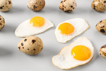 Fried quail eggs on grey background