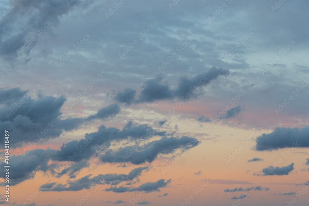 Wall mural cloudy sunset sky with a bit of colour.