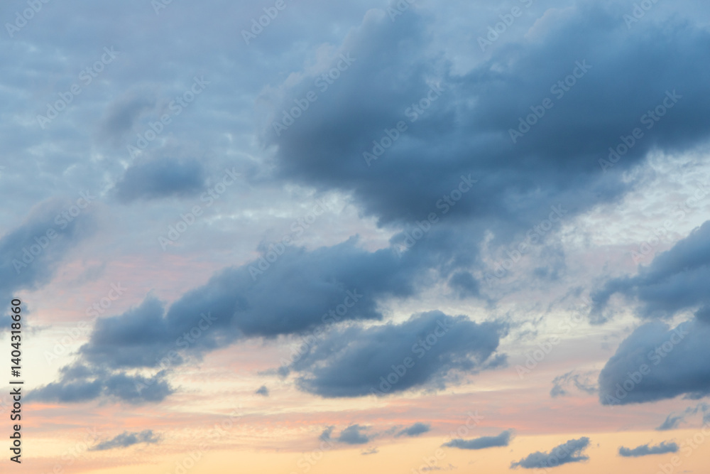Wall mural cloudy sunset sky with a bit of colour.