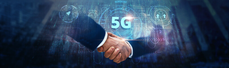 5G Technology: Businessman handshake on digital interface and high-speed connectivity across global network. Low latency, massive device communication, enhanced bandwidth, and real-time data transfer.
