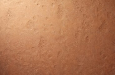 Close-up textured clay wall background with a brown orange gradient. Rough weathered surface. Earth tones, natural rustic backdrop for design, art, decoration. Clay house exterior or interior design.