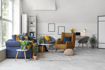 Cozy sofa, armchairs and coffee table in living room