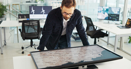 Business man, interactive display and map in office for sustainability, clean energy or wind turbine location. Global, world or worker with screen for planning project with renewable power specialist © peopleimages.com