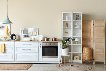 Peg boards and white counter in interior of kitchen