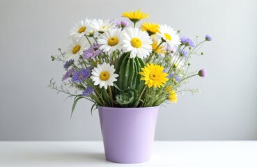 Vibrant floral arrangement in purple pot. White daisies yellow, purple and green flowers. Fresh beautiful flowers. Decorative spring bouquet. Home decor, gardening and floral design.