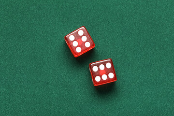 Red game dices on green background