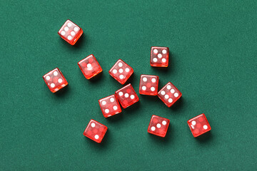 Red game dices on green background