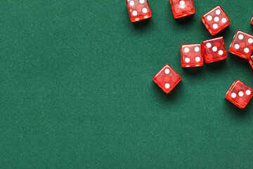 Red game dices on green background