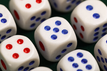 Dices with red and blue pips as background, closeup
