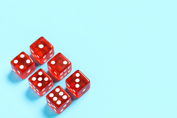 Red game dices on blue background