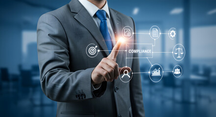 Obraz premium Businessman in Gray Suit Touching Virtual Interface with Futuristic Technology in Blue Toned Office Environment