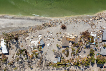 Destroyed houses on ocean coast. Hurricane Milton consequences in Englewood, Florida. Storm surge...