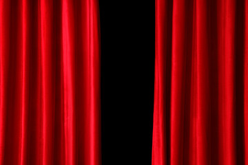 Red curtains on black background, closeup