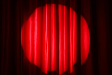 Red curtain on dark background