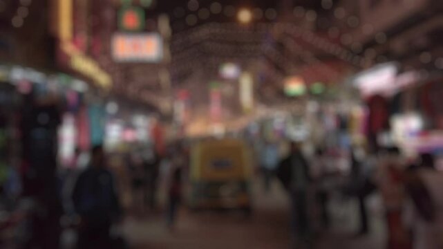 Bokeh view of evening at Main Bazaar street (New Delhi, India), decorated for Diwali celebration. Blurred background footage.