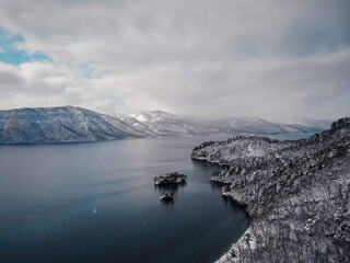 Aerial photography of Lake Towada in winter in Aomori Prefecture, Japan