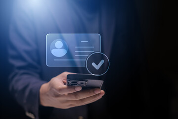 human hand holding digital identification card, with Checkmark Icons for Identity verification, ID card with checkmark. Personality approve. Employee badge.