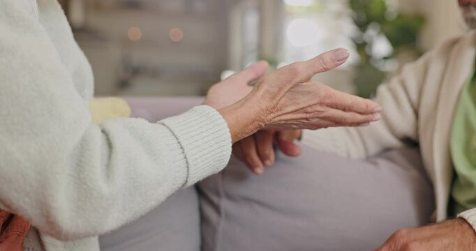Argument, hands and senior couple on sofa with angry conversation, disagreement and conflict in home. Marriage, old man and frustrated woman on couch with fight, discussion and stress for retirement