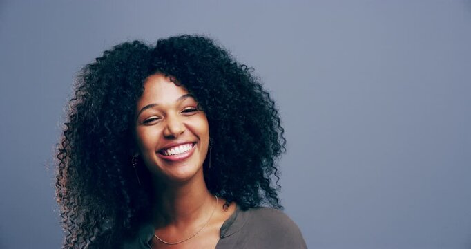 Woman, happy and comedy or laughing, face and studio by gray background, funny and joke in mockup. Black female person, smile and comic or silly, goofy and positive mindset for freedom or humor