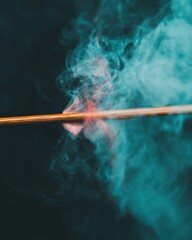 Naklejka premium Ethereal Smoke Dynamics Cinematic Artistic Visualization of Burning Incense with Teal Atmospheric Diffusion - Creative Visual Effects and Sensory Branding
