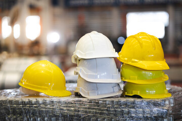 safety hard hat helmet. Close-up of protective helmet on Blurred heavy industrial factory in the...
