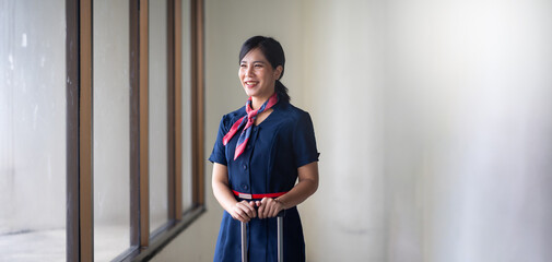 Portrait female Cabin crew or air hostess in airport. Cabin crew, air hostess working in airplane....