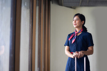 Portrait female Cabin crew or air hostess in airport. Cabin crew, air hostess working in airplane....