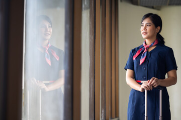 Portrait female Cabin crew or air hostess in airport. Cabin crew, air hostess working in airplane....