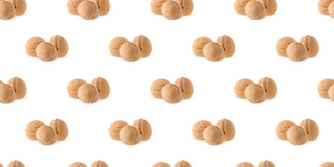 Walnuts forming a seamless pattern on a white background