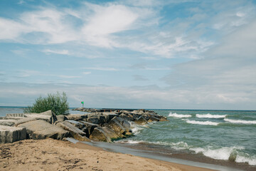 Waves crashing against rocky jetty at Lake Michigan