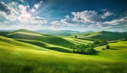 Fototapeta premium 青空の下に広がる緑の丘と牧草地、ふんわりとした雲と明るい自然光。